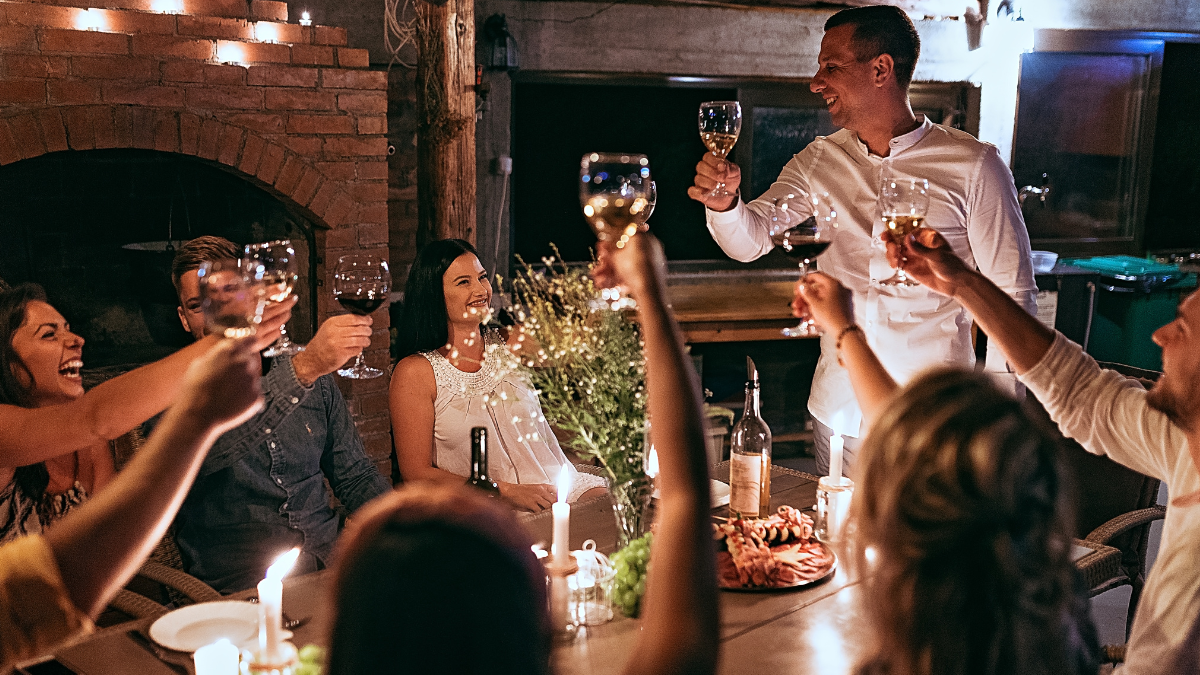A group of people having a company christmas party and celebrating.